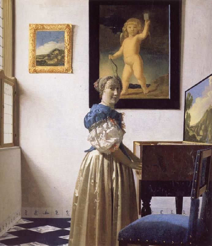 JanVermeer A Young Woman Standing at a Virginal France oil painting art